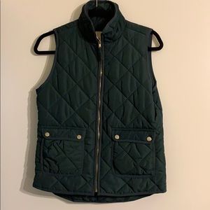 Green vest with gold details. Great condition!